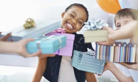 Happy girl receiving birthday gifts